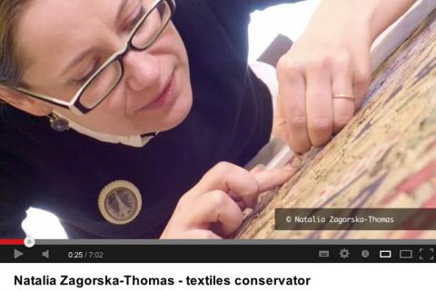 Natalia in a scene from the YouTube presentation on textile conservation