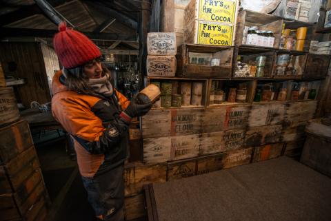 Lizzie Meek inside Cape Evans hut. Image by Alasdair Turner.