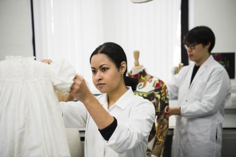 Clara Low mounting a costume