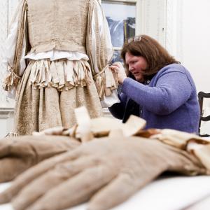 Rosamund mounting the C16 suit of Edmund Verney. Image courtesy National  Trust