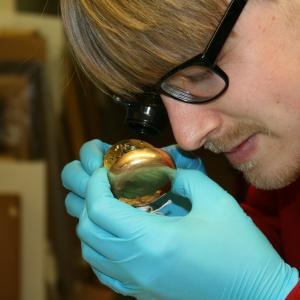 Dale examining a clock at the Russell-Cotes Museum