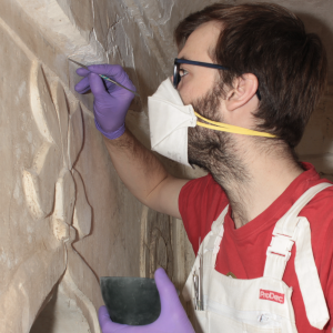 Joshua repairing plaster in the Hadi Rani Mahal, Nagaur Fort, India.